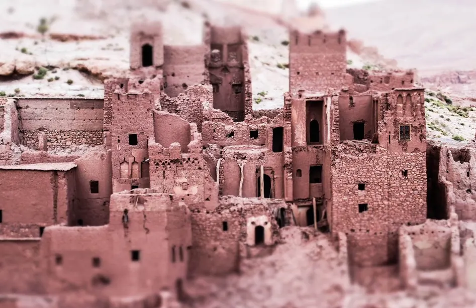 Earthen houses and towers in Ait Ben Haddou with small windows and adobe brick walls