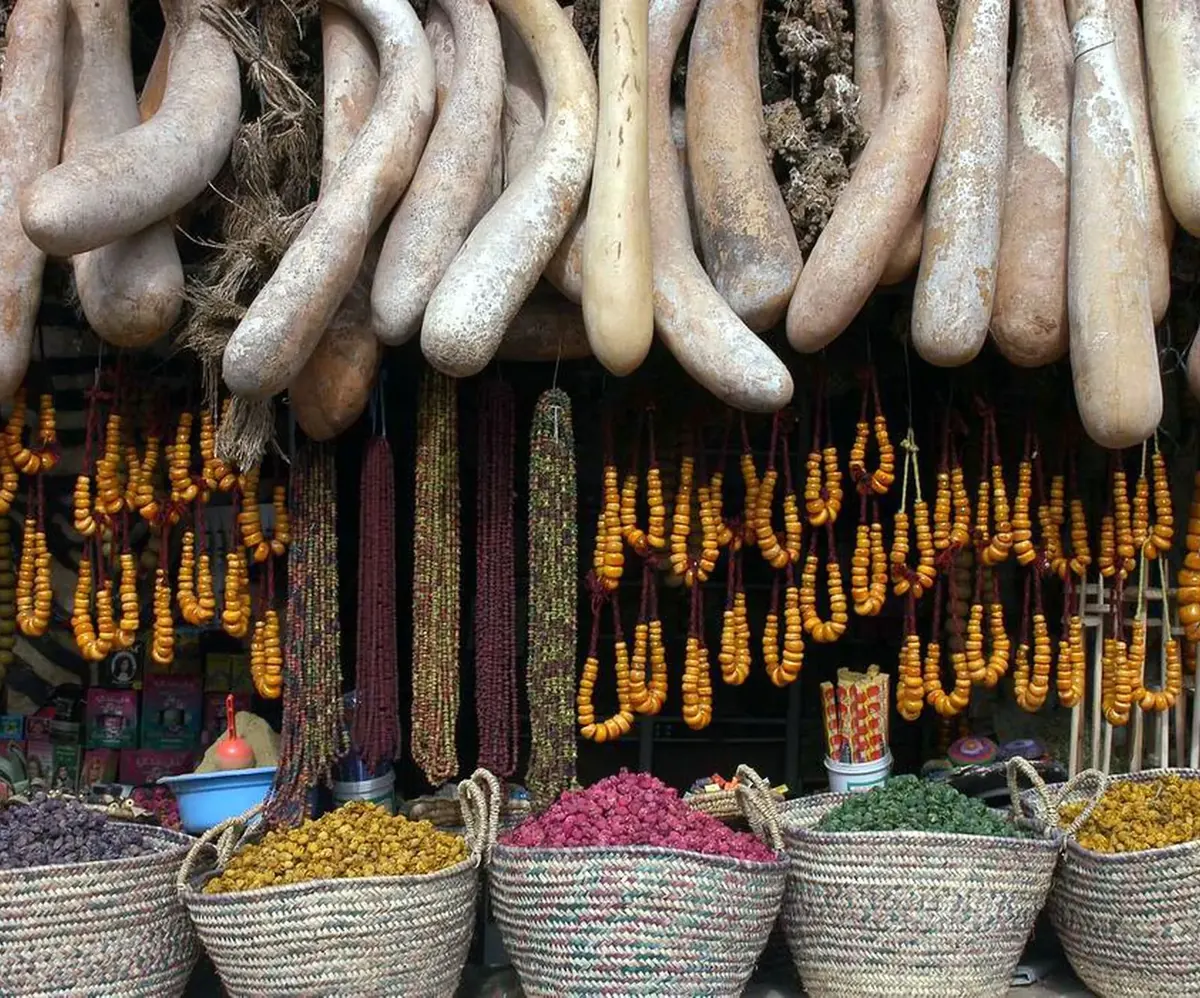 Herbalist stall with jars and spices in a Marrakech souk