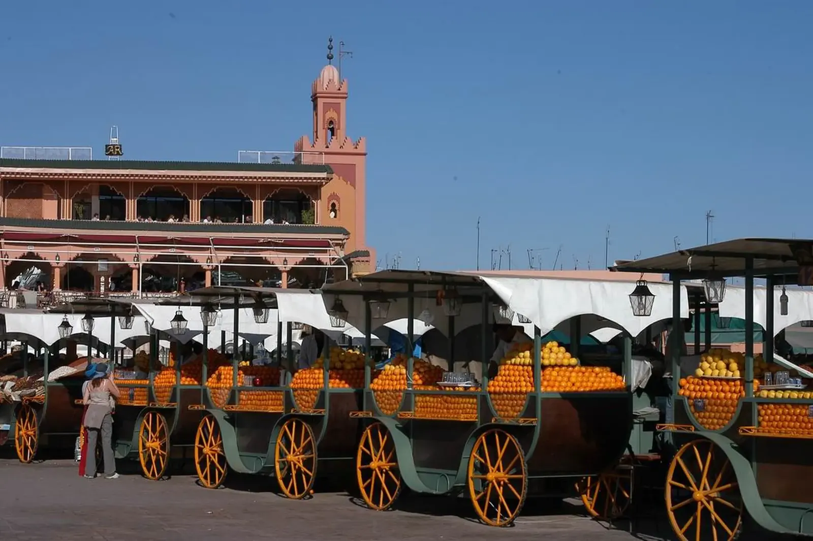 Orange juice stalls in Jemaa el-Fna square in Marrakech on a sunny day
